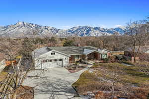 Ranch-style house featuring a mountain view and a garage