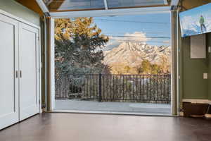 Yoga/exercise studio  featuring a mountain view and concrete floors