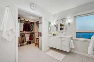 Bathroom featuring tile patterned floors and vanity