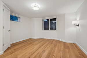 Spare room featuring light wood-type flooring