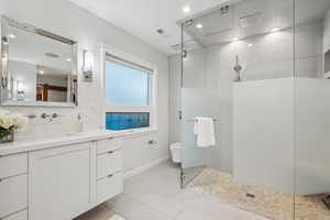 Bathroom with a shower and vanity