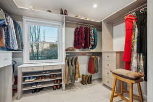 Walk in closet featuring tile patterned flooring