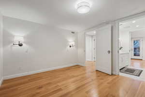 Spare room with light wood-type flooring