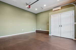 Studio  featuring a wall unit AC and concrete flooring