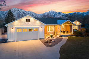 View of front of property featuring a mountain view and a garage