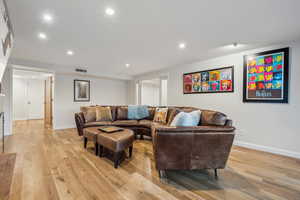 Living room with light hardwood / wood-style flooring