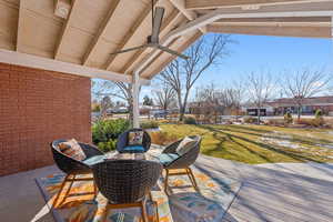 View of patio featuring ceiling fan and a deck