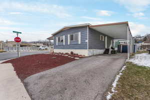 View of front facade with a carport