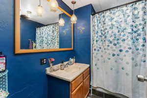 Bathroom featuring vanity and a shower with curtain