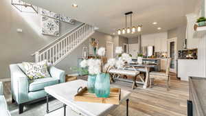 Living room with light hardwood / wood-style floors