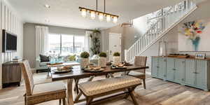 Dining area featuring light hardwood / wood-style floors and vaulted ceiling