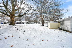 View of yard layered in snow