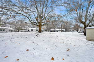 View of yard covered in snow