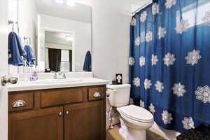 in-suite bathroom with vanity and tub/shower combo