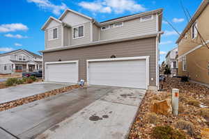 View of property with a garage