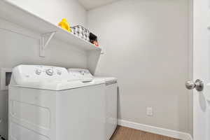 Laundry room featuring washing machine and dryer