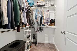 Spacious walk-in closet in primary bedroom