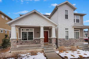 Craftsman-style twin-home featuring front porch