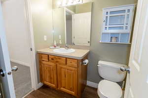 Bathroom featuring wood-style floor