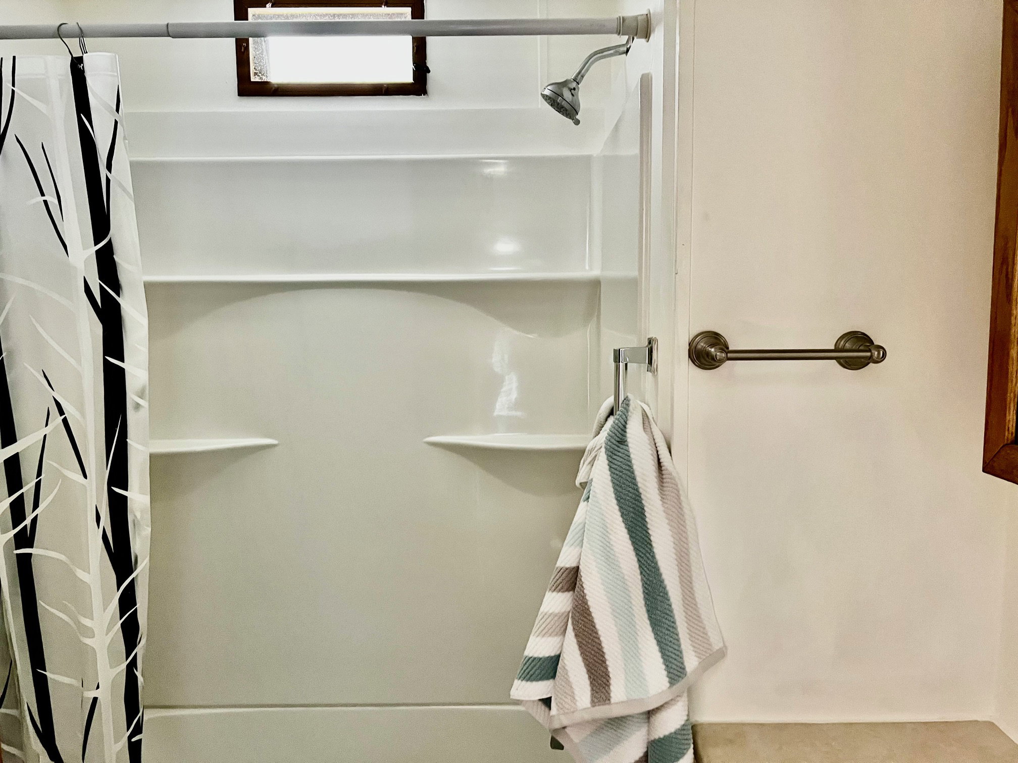 Bathroom featuring curtained shower
