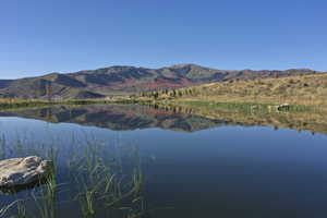 View of water feature with a mountain view