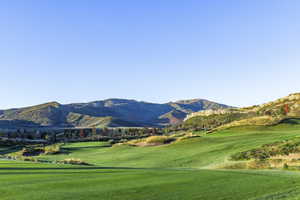 View of home's community with a lawn and a mountain view