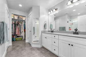 Bathroom with vanity and an enclosed shower