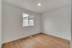 Empty room featuring light hardwood / wood-style flooring