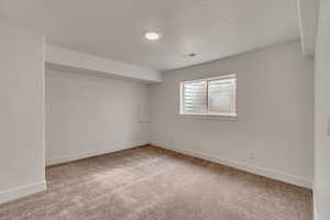 View of carpeted spare room