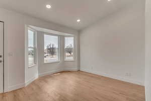 Spare room with light hardwood / wood-style flooring