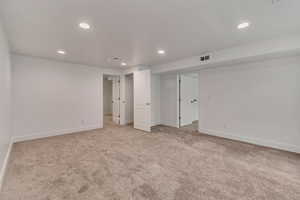 Unfurnished bedroom featuring light carpet