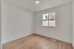 Spare room featuring light hardwood / wood-style floors