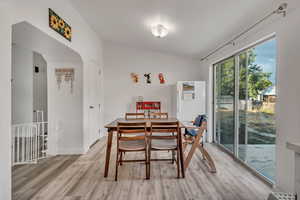 Dining space with hardwood / wood-style floors