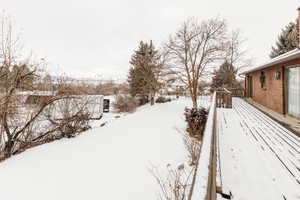 View of yard layered in snow