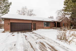 Single story home with a garage