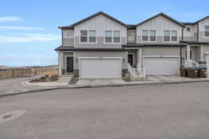 View of front of property featuring a garage