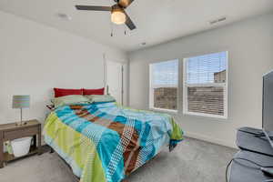 Primary bedroom with ceiling fan