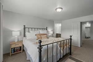 Primary Bedroom with ensuite bathroom and double doors exiting to Loft/Den/Payroom