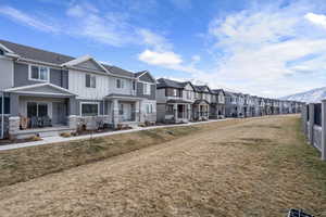 Exterior space featuring a mountain view and a front lawn