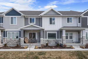 Craftsman-style home featuring covered porch. HOA takes care of all grass areas.