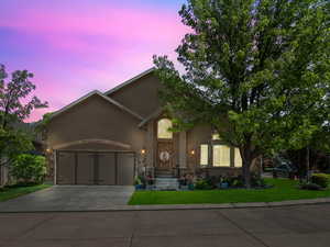 View of front facade featuring a garage