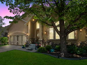 View of front of property with a lawn