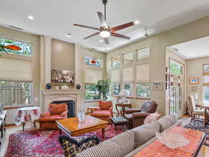 Living room featuring hardwood / wood-style flooring and ceiling fan