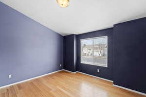 Spare room featuring hardwood / wood-style flooring