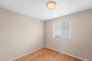 Unfurnished room with light hardwood / wood-style floors