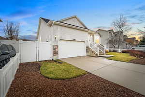 Property exterior at dusk with a yard