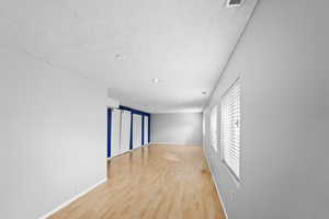 Spare room with light wood-type flooring