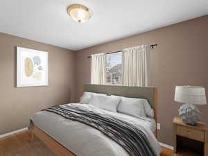 Bedroom featuring wood-type flooring