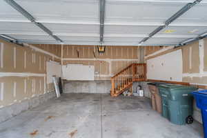 Garage featuring a garage door opener