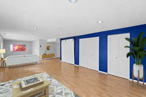 Living room with hardwood / wood-style flooring